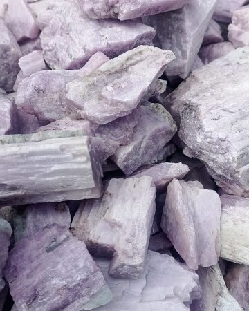 This stunning lithium kunzite ore, mined in Nigeria, symbolizes the country's vast potential in the renewable energy sector. A close-up of Nigerian lithium kunzite ore, a key component in lithium-ion batteries