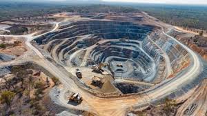 A breathtaking aerial view depicting a vast mining operation in Nigeria. This image symbolizes the immense potential of the country's mining industry and the importance of prioritizing safety to unlock its full potential. Aerial view depicting a large-scale mining operation in Nigeria, showcasing the industry's potential and the need for safety investments.