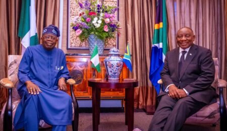 Nigerian President and South African President discussing strategic partnerships in the mining sector. Nigerian President and South African President in a discussion