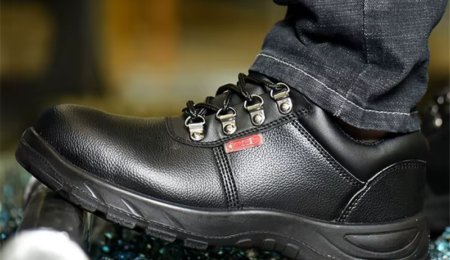 The Rugged Anti-Puncture Mining Boot, built for tough terrains. Rugged, dark brown anti-puncture mining boots with steel toe cap and thick rubber outsole.