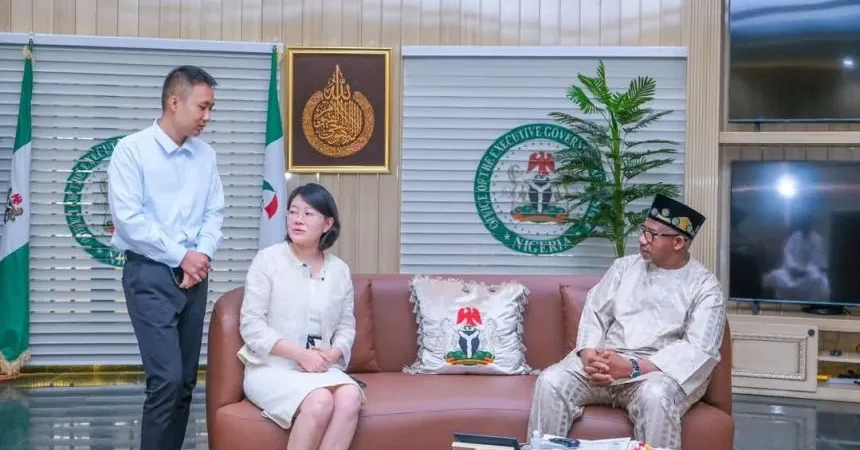 Governor Bala Mohammed of Bauchi with a representative from a Chinese firm, Minsheng Group, to formalize a new mining agreement.