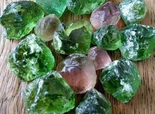 Vibrant bi-color (green and pink) Nigerian tourmaline crystal from a deposit in Nigeria, showcasing the country's gemstone wealth.
